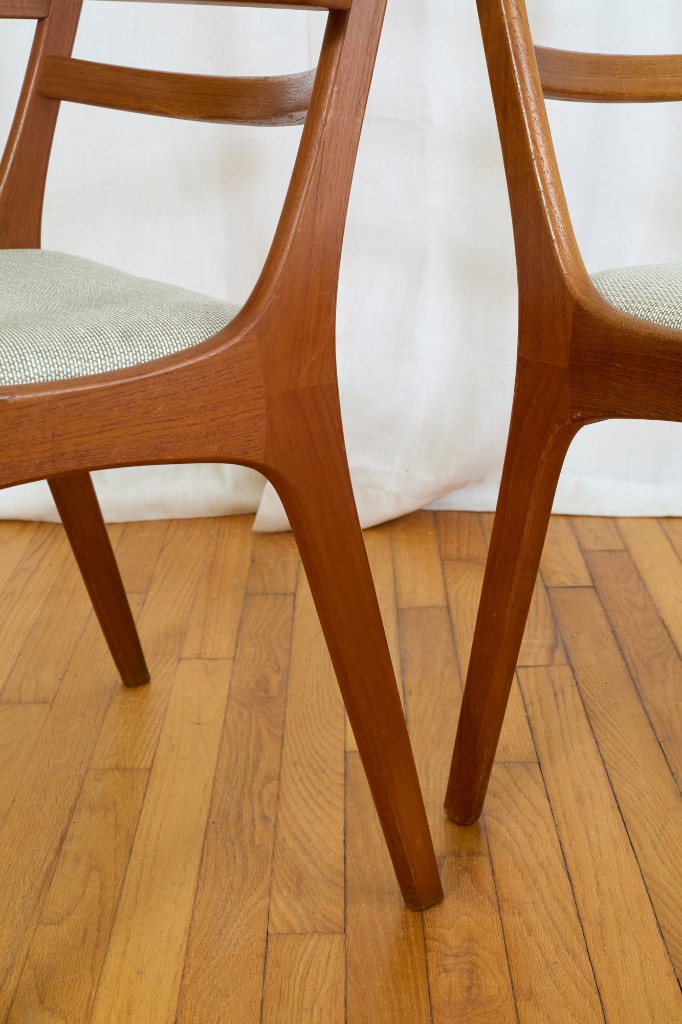 Low perspective — tapered legs, upholstery, and floor detail