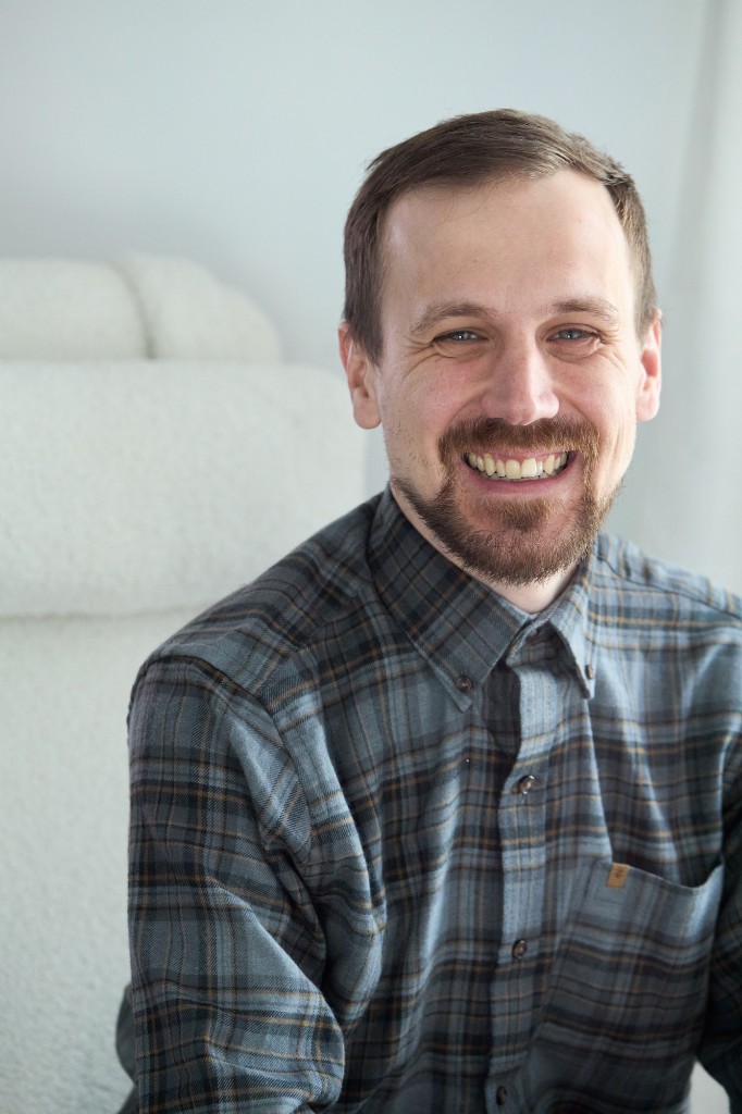 Closer framing — soft window light and an authentic expression